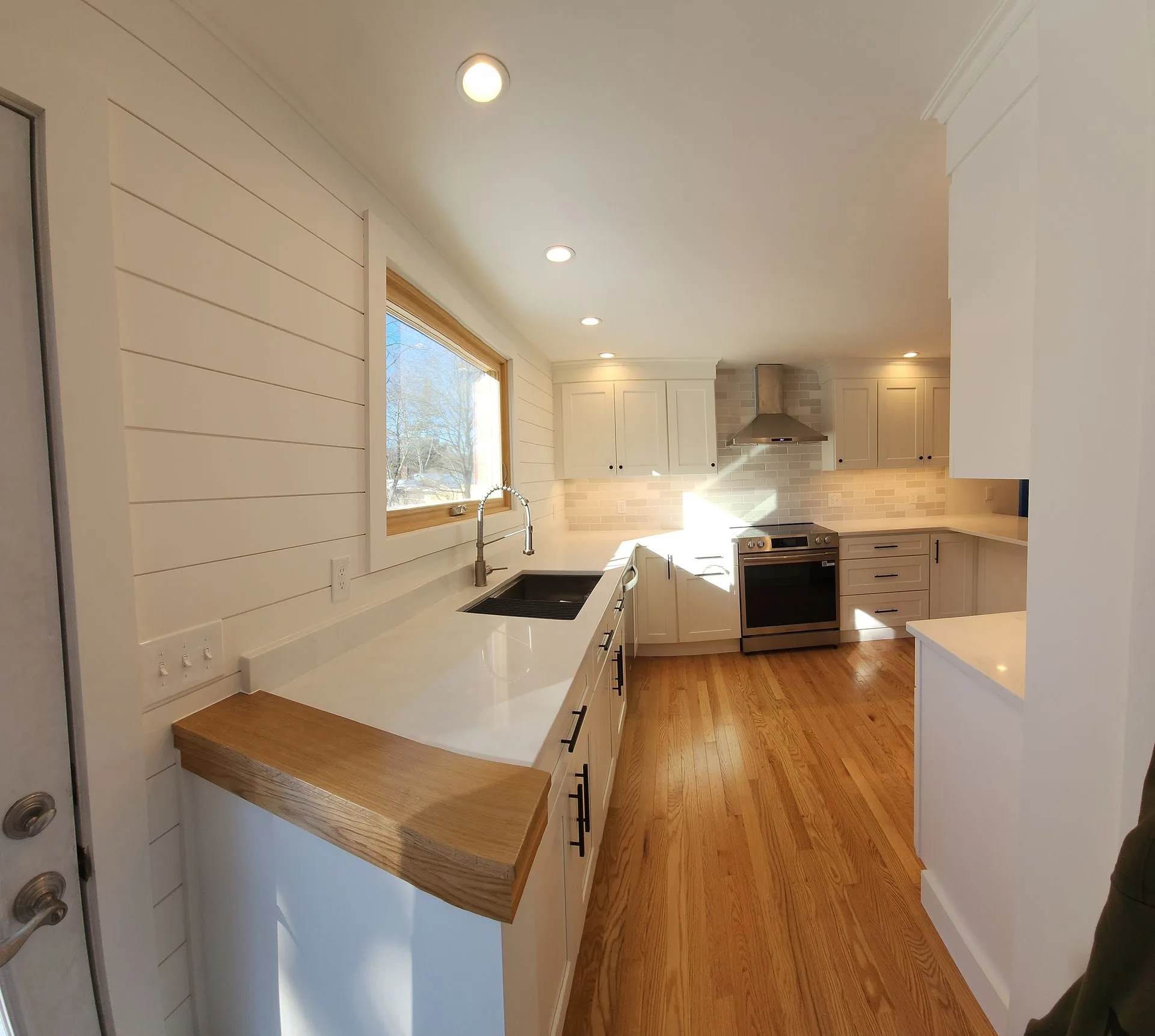 White kitchen renovation by Maineland Carpentry